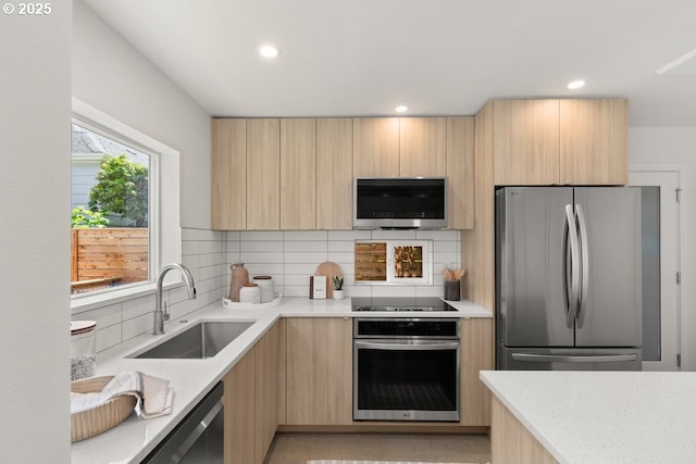 2415 NE 38th Ave Unit B, Portland, OR 97212 - kitchen featuring stainless steel appliances, light brown cabinets, modern cabinets, and recessed lighting