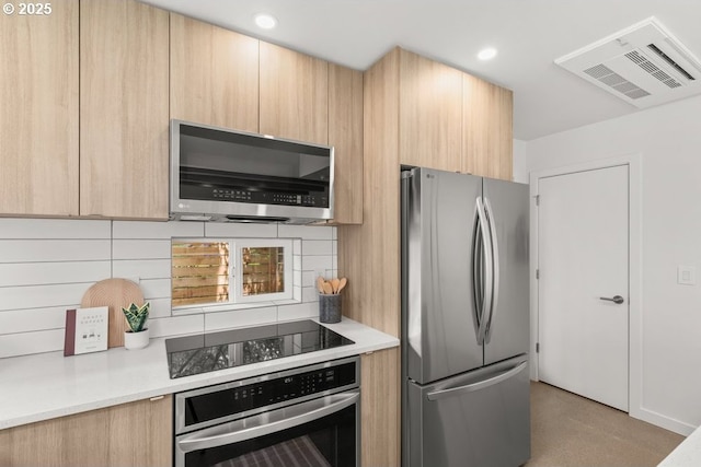 2415 NE 38th Ave Unit B, Portland, OR 97212 - kitchen featuring appliances with stainless steel finishes, light brown cabinets, modern cabinets, and recessed lighting