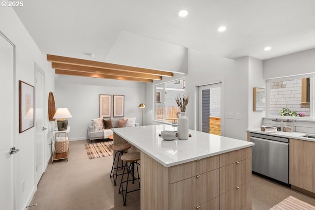 2415 NE 38th Ave Unit B, Portland, OR 97212 - kitchen with stainless steel dishwasher, modern cabinets, light brown cabinetry, a breakfast bar, and recessed lighting