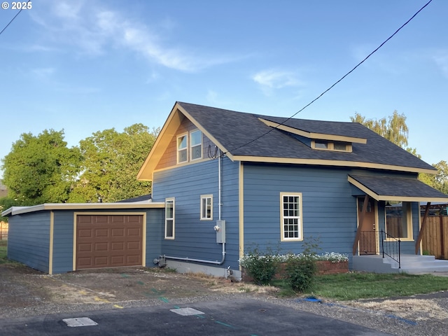 91213 N Harrison St, Eugene, OR 97408 - view of side of home with a garage, driveway, and roof with shingles