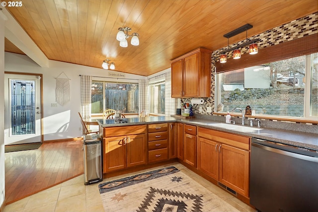211 W 16th St, The Dalles, OR 97058 - kitchen featuring dishwasher, a sink, wood ceiling, brown cabinetry, and plenty of natural light