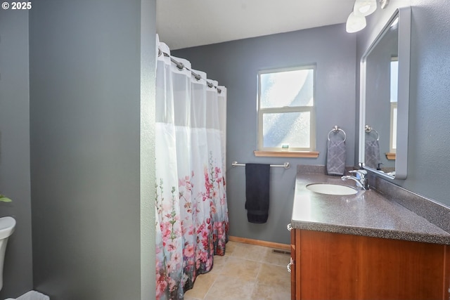 full bathroom featuring baseboards, toilet, tile patterned floors, curtained shower, and vanity