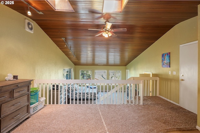 211 W 16th St, The Dalles, OR 97058 - additional living space with vaulted ceiling, a textured wall, wooden ceiling, a skylight, and carpet floors