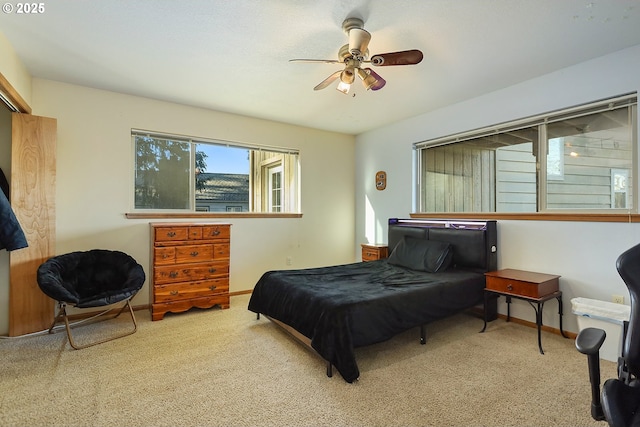 bedroom featuring ceiling fan, carpet flooring, and baseboards