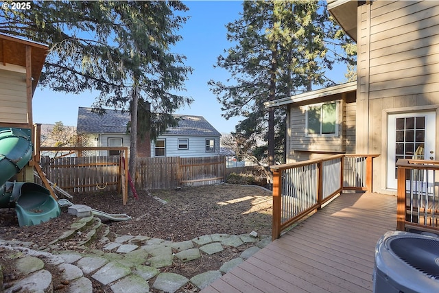 wooden terrace featuring a fenced backyard