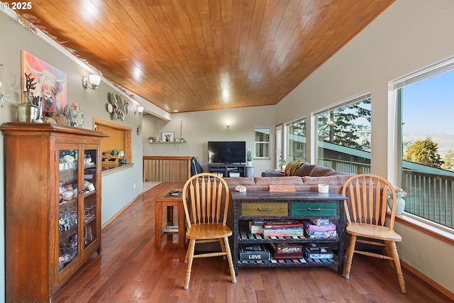 interior space featuring wooden ceiling, baseboards, and hardwood / wood-style flooring