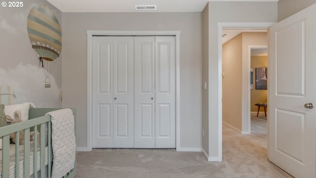 9336 SE Middleton St, Happy Valley, OR 97086 - bedroom with light colored carpet, a closet, and baseboards