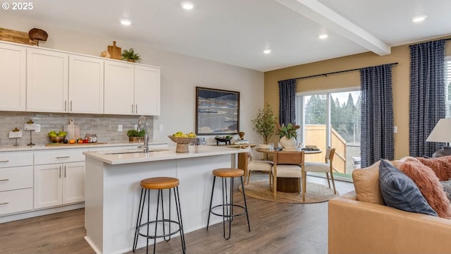 9336 SE Middleton St, Happy Valley, OR 97086 - kitchen with a sink, wood finished floors, light countertops, decorative backsplash, and open floor plan
