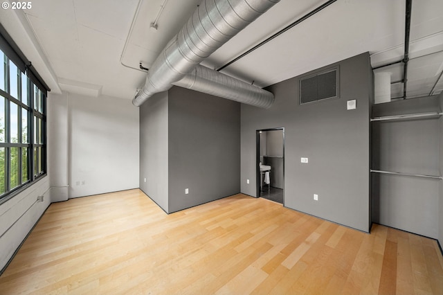 spare room featuring wood finished floors