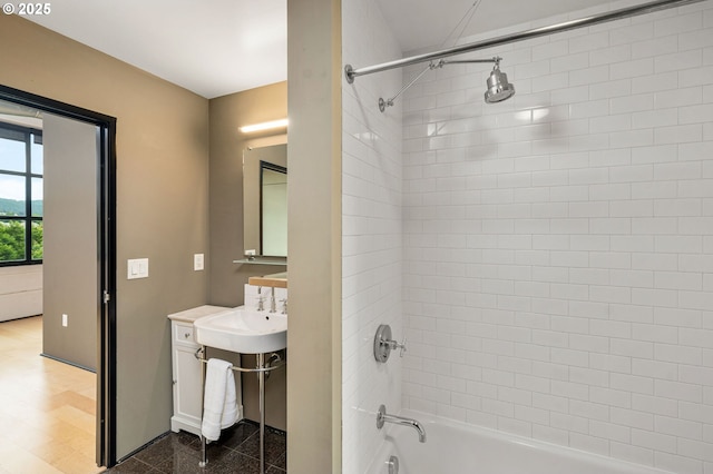 bathroom featuring shower / bathtub combination and a sink