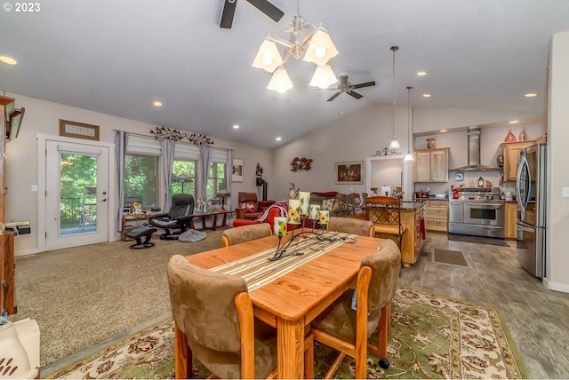 48482 E Meadow Way, Oakridge, OR 97463 - dining space with ceiling fan, vaulted ceiling, a chandelier, recessed lighting, and wood finished floors