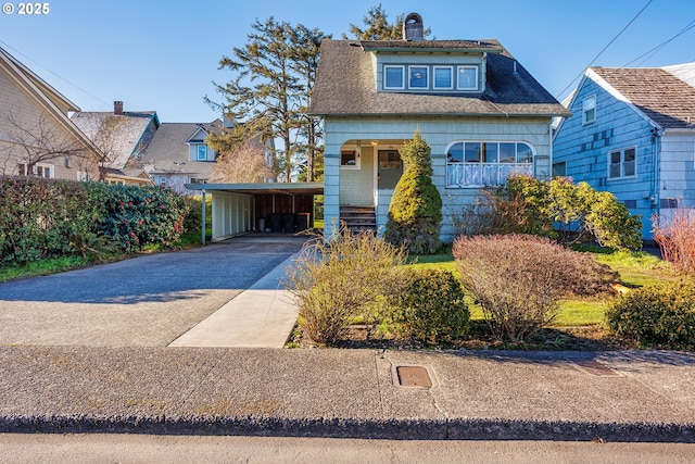 view of front of home with a carport