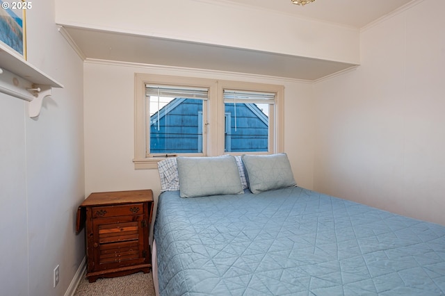 carpeted bedroom with ornamental molding