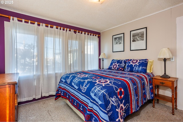 bedroom featuring carpet flooring and a textured ceiling