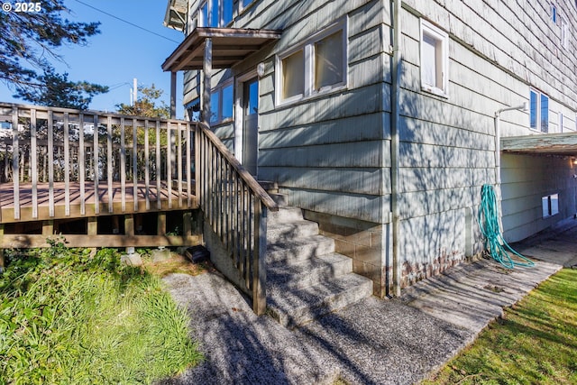 view of side of home featuring a deck