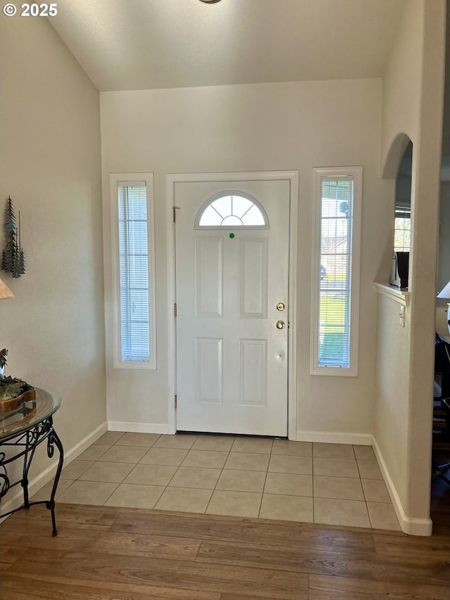 tiled entrance foyer with baseboards