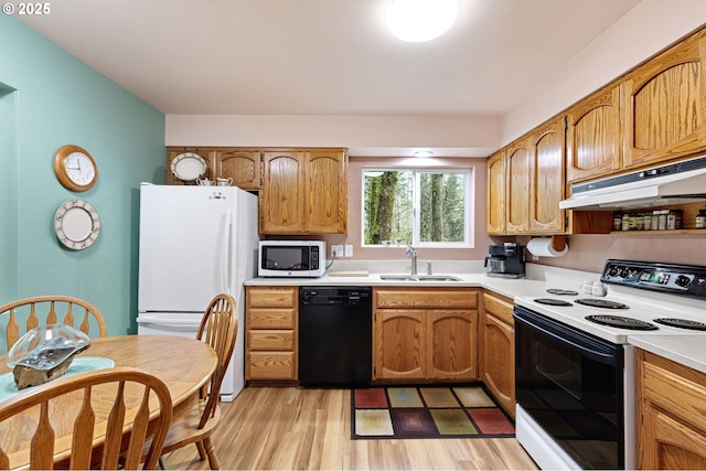 29806 Lusk Rd, Eugene, OR 97405 - kitchen featuring white appliances, a sink, under cabinet range hood, light countertops, and light wood-style floors