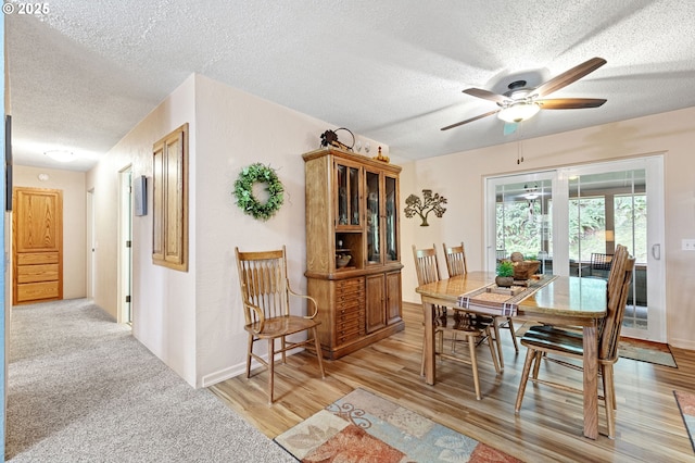 29806 Lusk Rd, Eugene, OR 97405 - dining area featuring a textured ceiling, a ceiling fan, and light wood-style floors