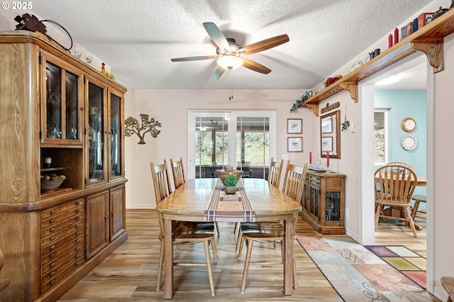 29806 Lusk Rd, Eugene, OR 97405 - dining space with ceiling fan, light wood-style floors, and a textured ceiling