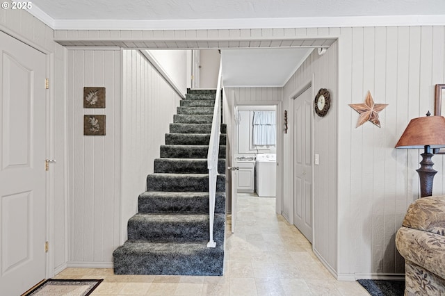 29806 Lusk Rd, Eugene, OR 97405 - staircase featuring washer / clothes dryer, crown molding, and wood walls