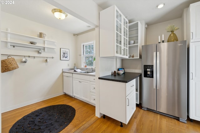 1224 SE Malden St, Portland, OR 97202 - kitchen featuring stainless steel refrigerator with ice dispenser, open shelves, light wood-style flooring, white cabinets, and recessed lighting