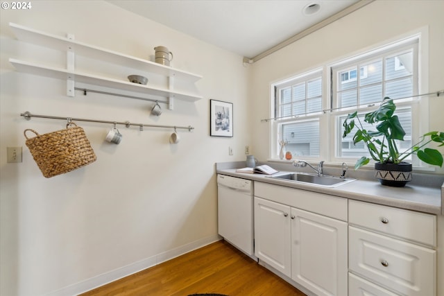 1224 SE Malden St, Portland, OR 97202 - kitchen with white dishwasher, open shelves, light wood-style flooring, and white cabinetry