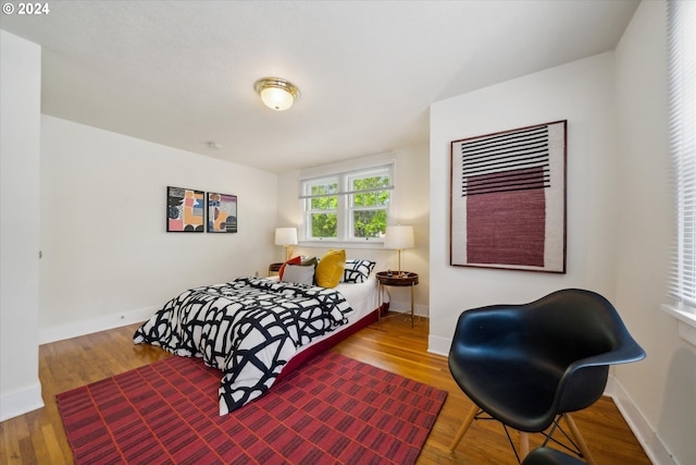 1224 SE Malden St, Portland, OR 97202 - bedroom with baseboards and wood finished floors