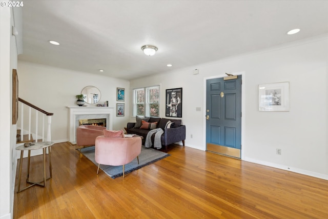 1224 SE Malden St, Portland, OR 97202 - living room featuring wood finished floors, a fireplace, stairs, and recessed lighting