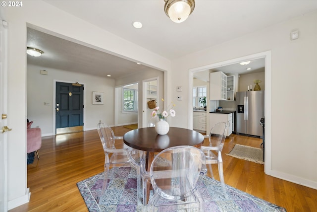 1224 SE Malden St, Portland, OR 97202 - dining area featuring plenty of natural light and light wood-style floors
