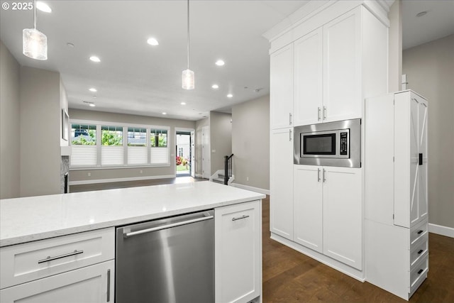 3825 NW 74th Ave Unit 59, Camas, WA 98607 - kitchen with appliances with stainless steel finishes, recessed lighting, white cabinets, hanging light fixtures, and dark wood finished floors