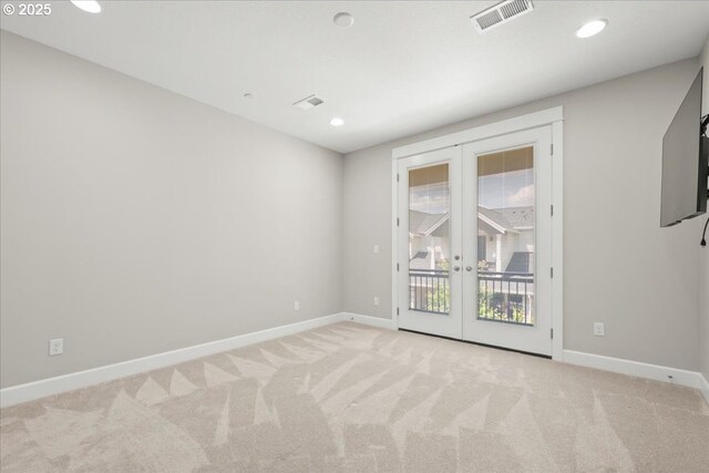 3825 NW 74th Ave Unit 59, Camas, WA 98607 - spare room with french doors, baseboards, light carpet, and recessed lighting