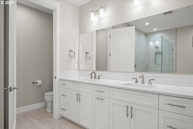 3825 NW 74th Ave Unit 59, Camas, WA 98607 - full bath with double vanity, a shower stall, toilet, baseboards, and recessed lighting
