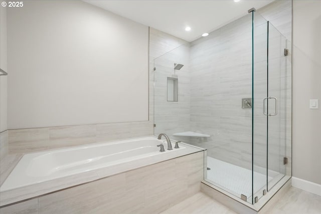 3825 NW 74th Ave Unit 59, Camas, WA 98607 - bathroom featuring a bath, a shower stall, and recessed lighting