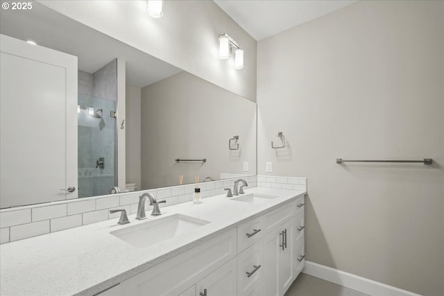 3825 NW 74th Ave Unit 59, Camas, WA 98607 - bathroom featuring double vanity, a stall shower, baseboards, and toilet