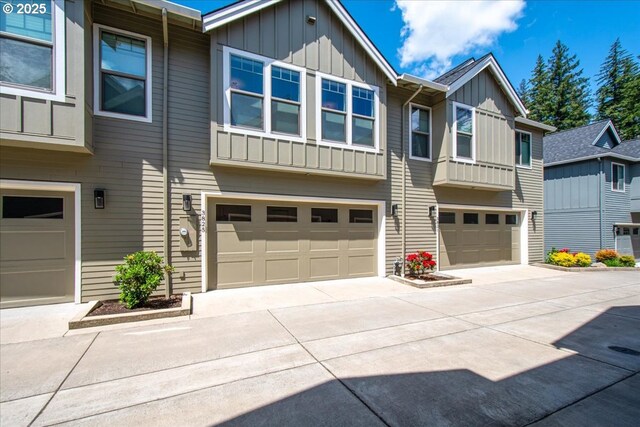 3825 NW 74th Ave Unit 59, Camas, WA 98607 - view of front facade featuring board and batten siding, an attached garage, and driveway