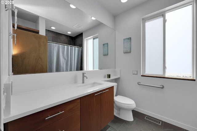 bathroom featuring tile patterned flooring, baseboards, vanity, toilet, and a shower with curtain