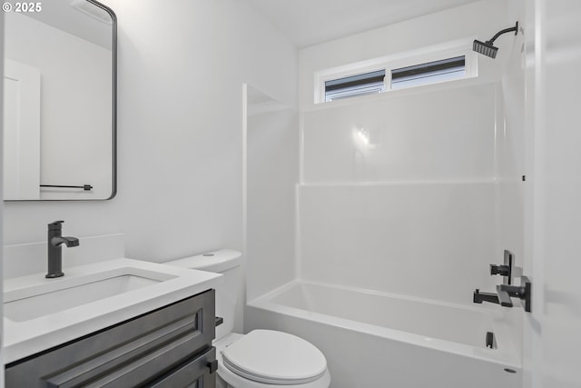 full bathroom featuring toilet, vanity, and shower / washtub combination