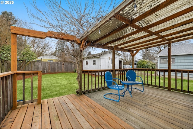 wooden deck with an outbuilding and a yard