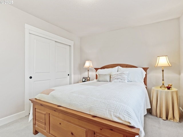 carpeted bedroom with a closet