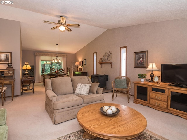 140 NE Greenway Dr, Gresham, OR 97030 - living room featuring light colored carpet, a ceiling fan, lofted ceiling, and a wood stove