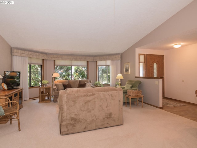 140 NE Greenway Dr, Gresham, OR 97030 - living room featuring plenty of natural light, light carpet, and vaulted ceiling