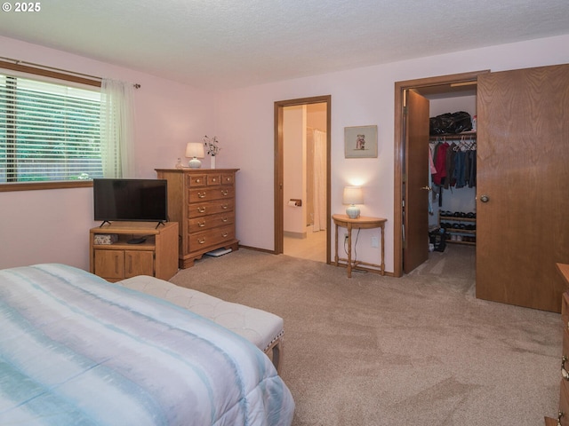 140 NE Greenway Dr, Gresham, OR 97030 - bedroom featuring light carpet, a walk in closet, and a closet