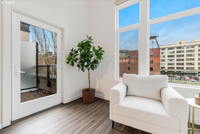 sitting room with wood finished floors and baseboards