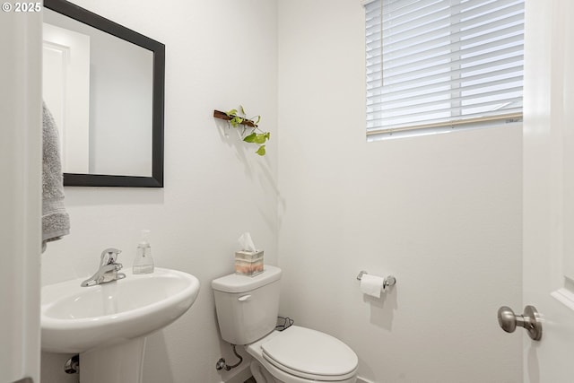 301 W 17th St, Lafayette, OR 97127 - half bath featuring toilet, baseboards, and a sink