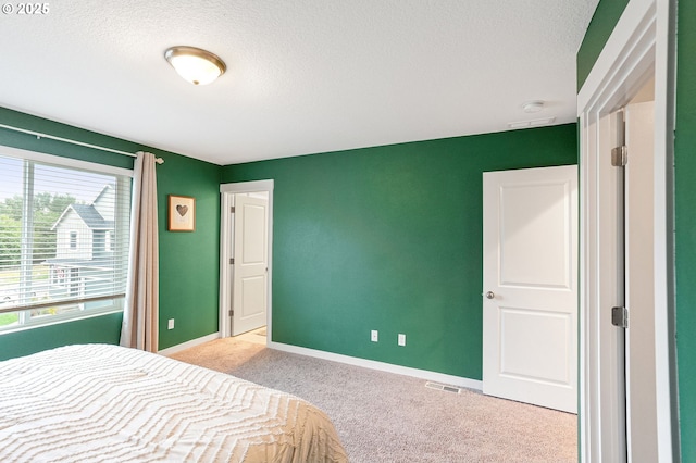 301 W 17th St, Lafayette, OR 97127 - carpeted bedroom featuring a textured ceiling and baseboards