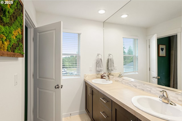 301 W 17th St, Lafayette, OR 97127 - bathroom with double vanity, baseboards, and recessed lighting