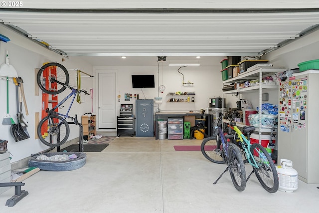 301 W 17th St, Lafayette, OR 97127 - garage featuring a garage door opener and fridge