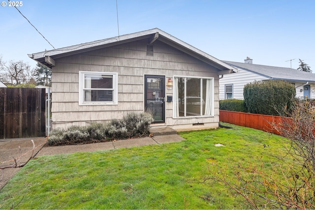 view of front of home with a front lawn