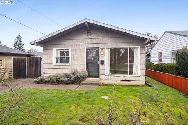 rear view of house with a yard