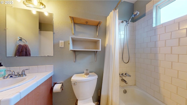 full bathroom featuring shower / tub combo with curtain, toilet, and sink